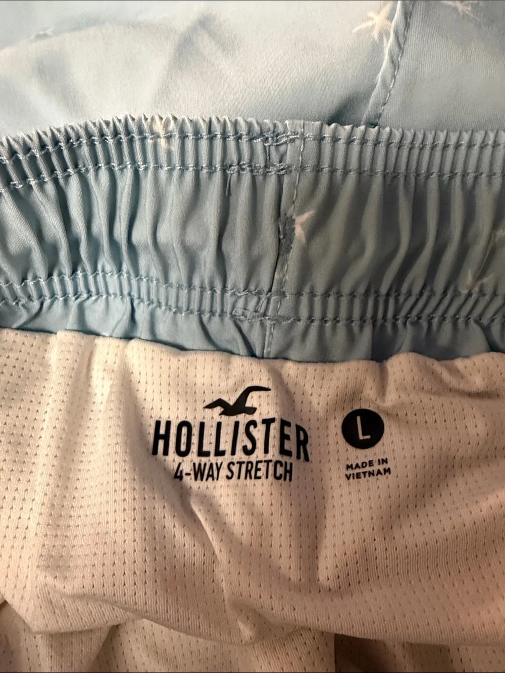 Hollister light blue palm tree pattern mid thigh swim trunks L